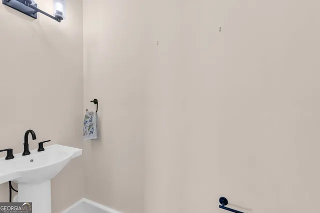 a bathroom with a sink a mirror and vanity