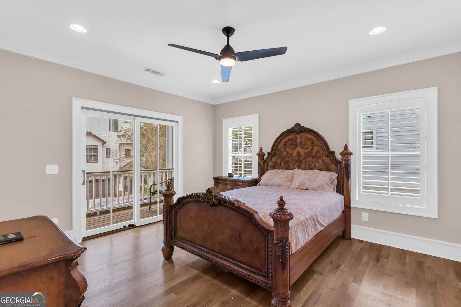 205 Flesner Court Clarkesville, GA 30523 - Photo 20 of 41 a bedroom with a bed next to a large window with wooden floor