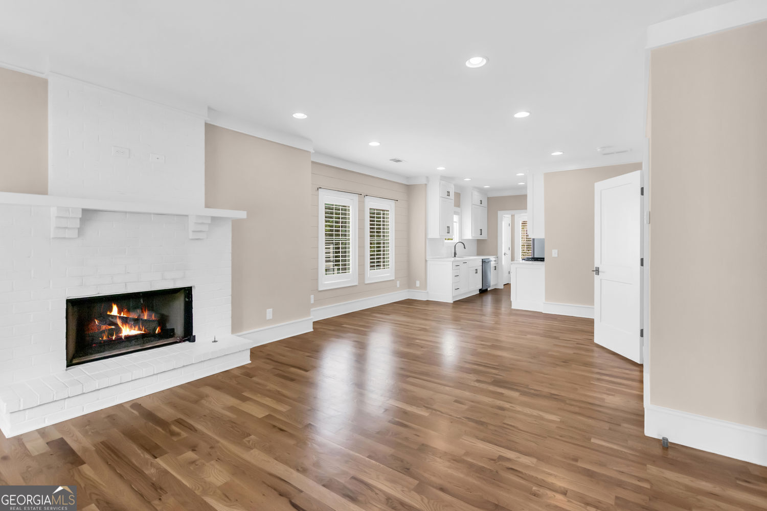 205 Flesner Court Clarkesville, GA 30523 - Photo 2 of 41 a view of empty room with wooden floor and fireplace