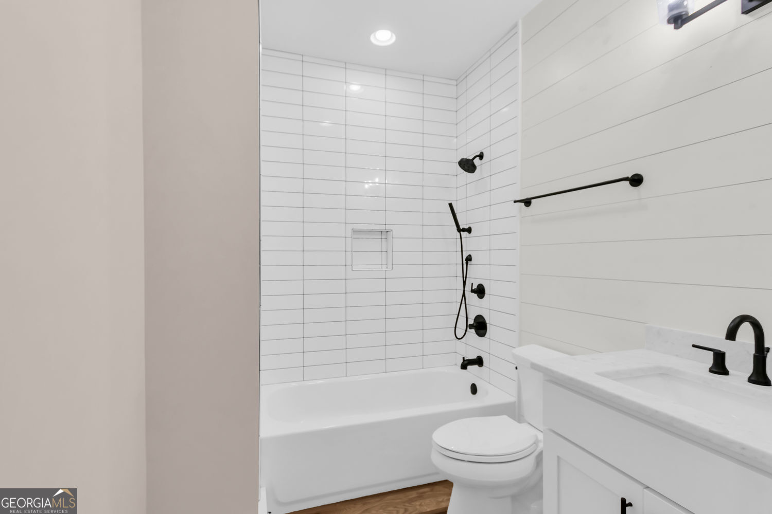 205 Flesner Court Clarkesville, GA 30523 - Photo 29 of 41 a bathroom with a bathtub a sink a toilet and a window