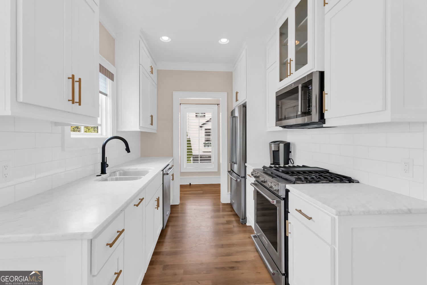 205 Flesner Court Clarkesville, GA 30523 - Photo 3 of 41 a kitchen with stainless steel appliances granite countertop a stove top oven a sink a refrigerator and white cabinets