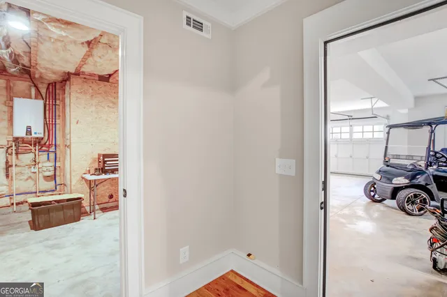 view of living room with furniture and a large mirror next to a window