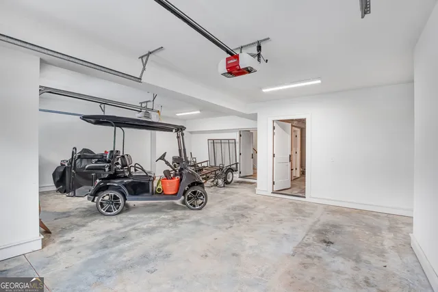 a view of a garage with a white car parked