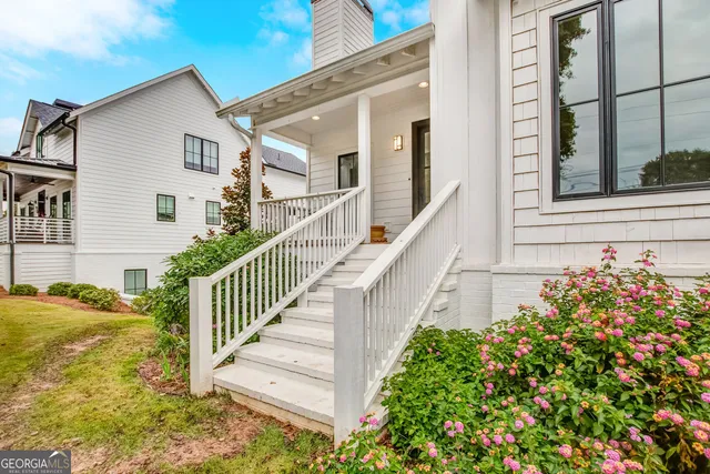 a view of a house with a flower garden