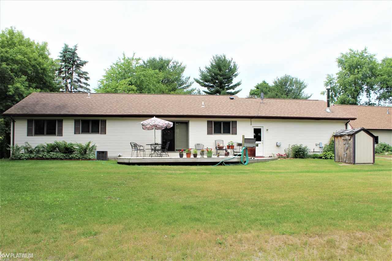 2850 Goodells Road Goodells, MI 48027 - Photo 32 of 42 Beautiful yard for summer activities or just relaxing on the treated deck.
