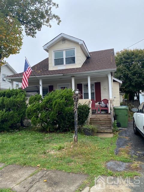 210 Washington Avenue Edison, NJ 08817 - Photo 1 of 5 a front view of a house with a yard