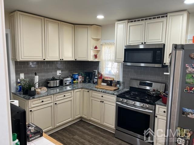 210 Washington Avenue Edison, NJ 08817 - Photo 2 of 5 a kitchen with cabinets stainless steel appliances and a sink