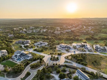 an aerial view of residential houses with outdoor space