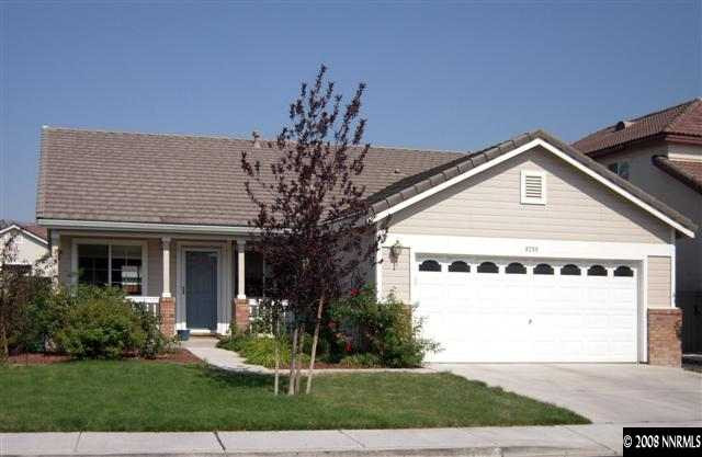 9788 Thunder Mountain Way Reno, NV 89521 - Photo 1 of 5 a front view of a house with a yard garage and outdoor seating