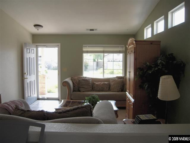 9788 Thunder Mountain Way Reno, NV 89521 - Photo 2 of 5 a living room with furniture and a window