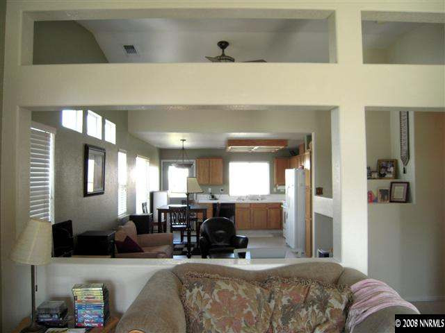 9788 Thunder Mountain Way Reno, NV 89521 - Photo 3 of 5 a living room with furniture and a large window