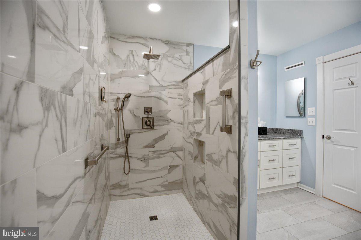 14382 Sedwick Avenue Solomons, MD 20688 - Photo 26 of 90 Zero-clearance shower, fully tiled