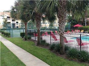10764 70th Avenue, Unit 1102 Seminole, FL 33772 - Photo 18 of 25 a view of a park with iron fence