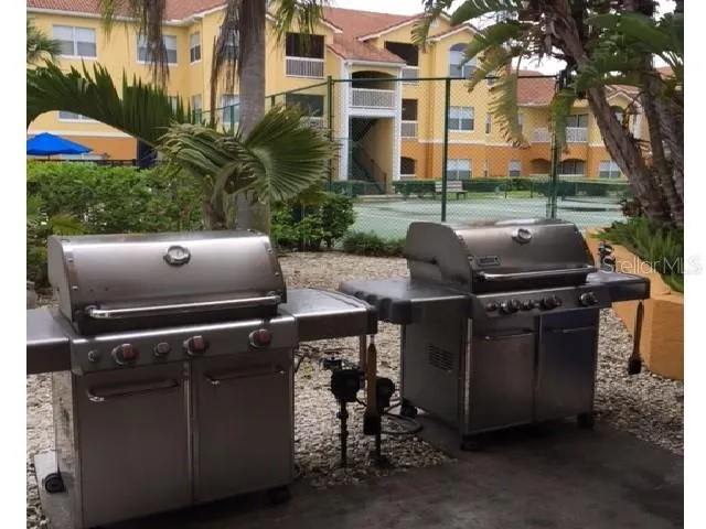 a living room with fireplace furniture and a large window