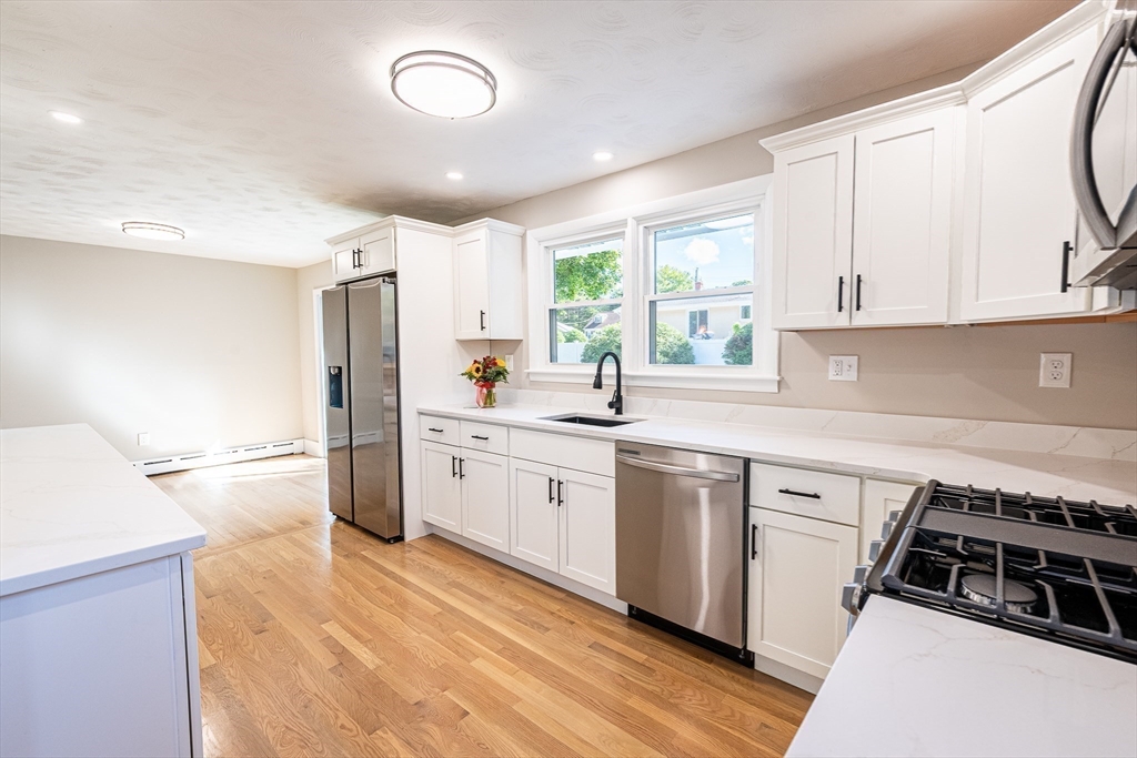 17 Hamlet Street Fairhaven, MA 02719 - Photo 15 of 40 a kitchen with a sink stove and refrigerator