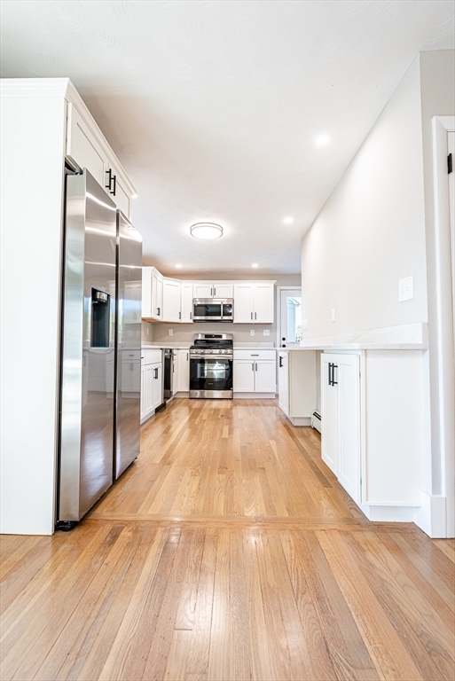 17 Hamlet Street Fairhaven, MA 02719 - Photo 18 of 40 a view of kitchen electric appliances cabinets and wooden floor