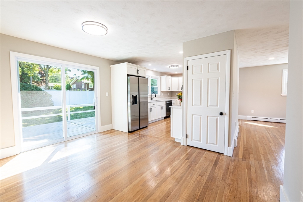 17 Hamlet Street Fairhaven, MA 02719 - Photo 19 of 40 a view of a kitchen with wooden floor and a refrigerator