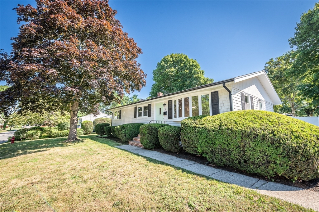 17 Hamlet Street Fairhaven, MA 02719 - Photo 2 of 40 a front view of a house with a garden