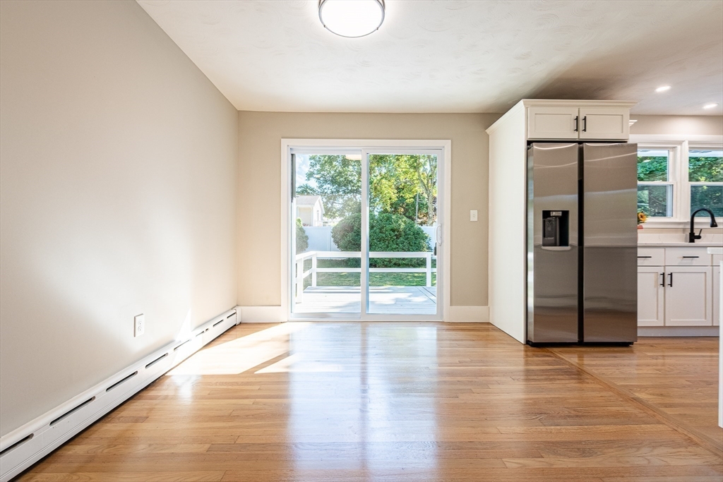 17 Hamlet Street Fairhaven, MA 02719 - Photo 21 of 40 a view of a kitchen with a refrigerator wooden floor and windows