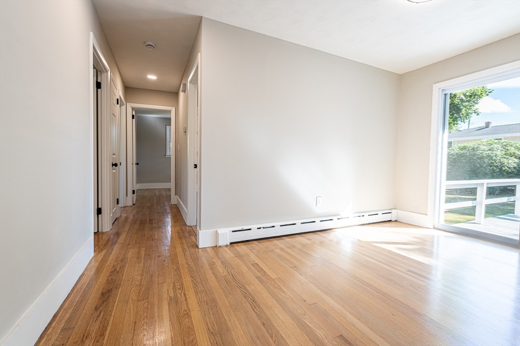 17 Hamlet Street Fairhaven, MA 02719 - Photo 22 of 40 wooden floor in an empty room with a window