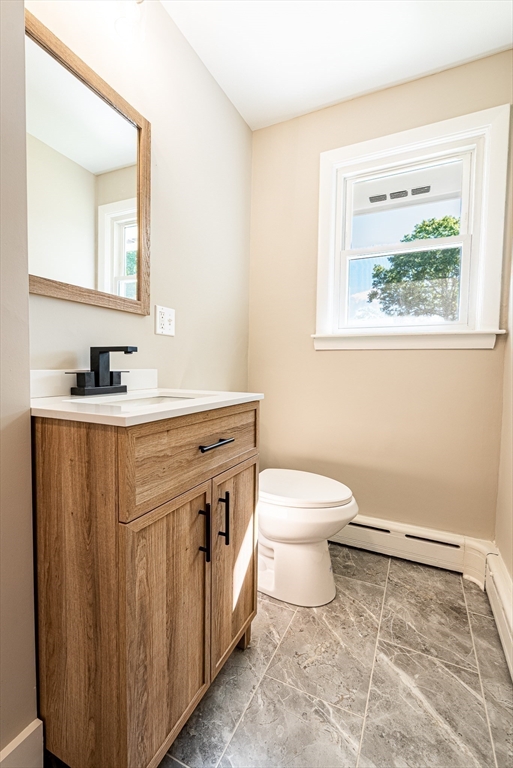 17 Hamlet Street Fairhaven, MA 02719 - Photo 25 of 40 a bathroom with a sink a toilet and a mirror