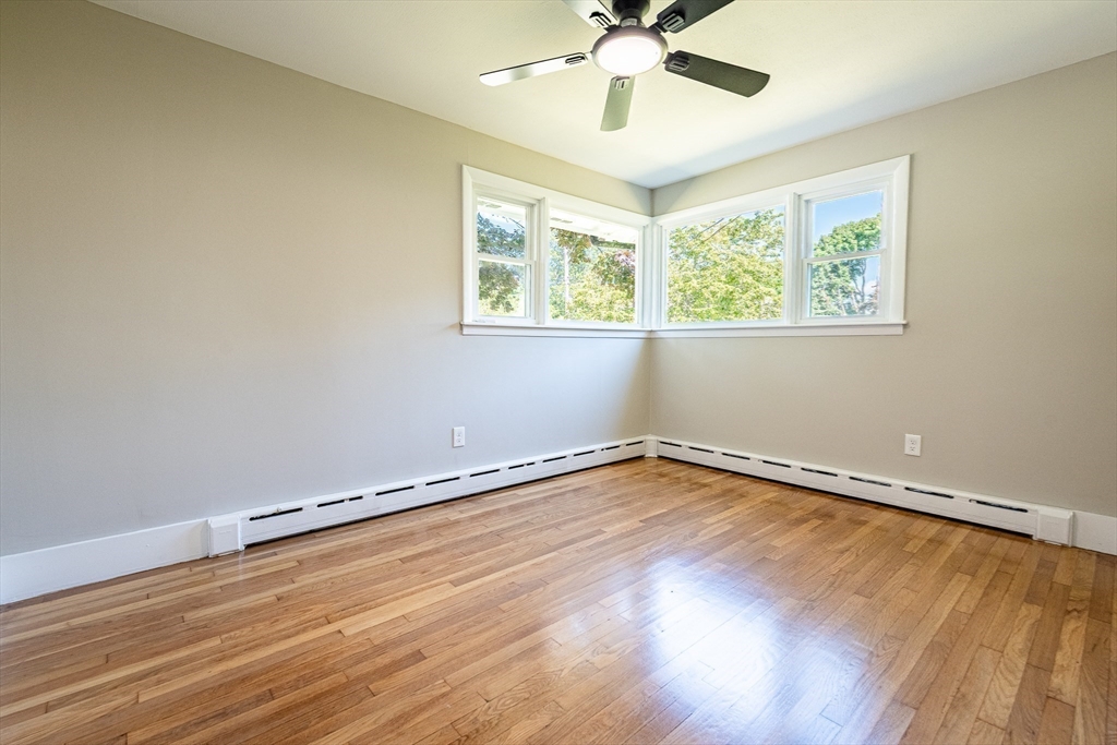17 Hamlet Street Fairhaven, MA 02719 - Photo 27 of 40 a view of an empty room with wooden floor and a window