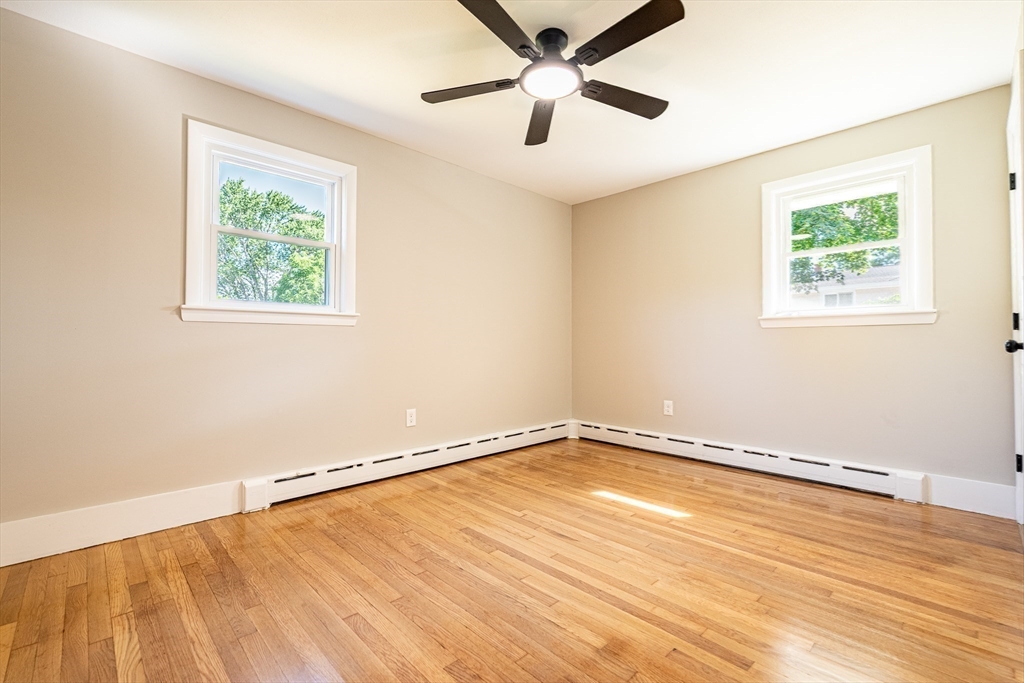 17 Hamlet Street Fairhaven, MA 02719 - Photo 29 of 40 a view of an empty room with wooden floor and a window