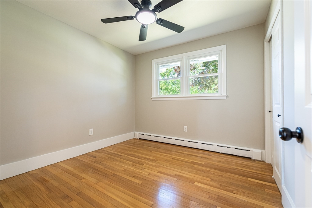 17 Hamlet Street Fairhaven, MA 02719 - Photo 30 of 40 wooden floor in an empty room with a window