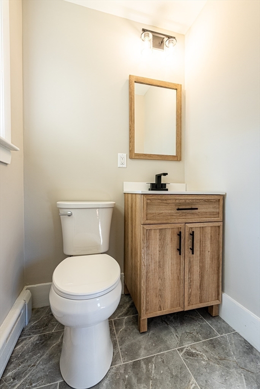 17 Hamlet Street Fairhaven, MA 02719 - Photo 32 of 40 a bathroom with a toilet sink and mirror