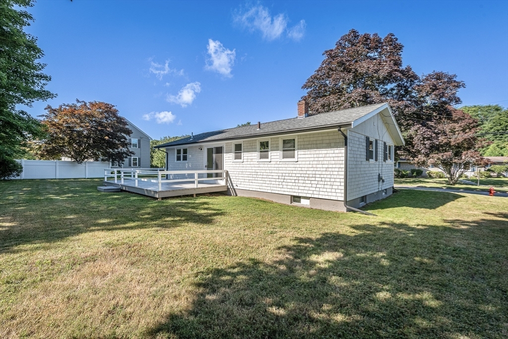 17 Hamlet Street Fairhaven, MA 02719 - Photo 38 of 40 a view of a house with a big yard and a large tree
