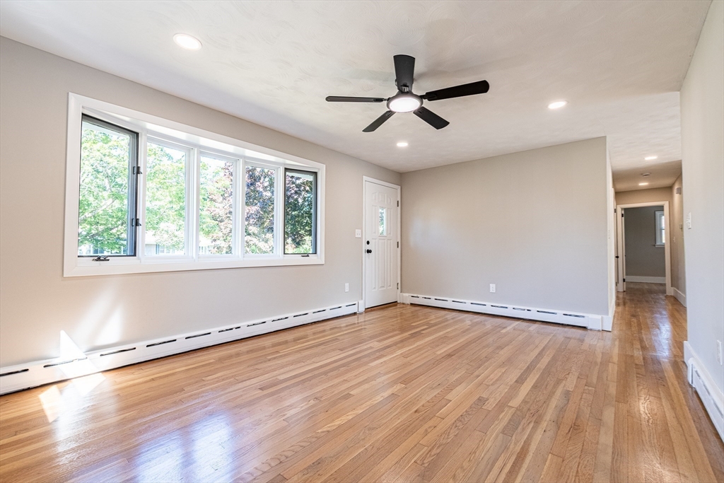 17 Hamlet Street Fairhaven, MA 02719 - Photo 7 of 40 a view of an empty room with wooden floor and a window