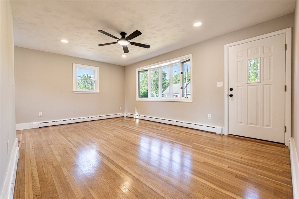 17 Hamlet Street Fairhaven, MA 02719 - Photo 10 of 40 a view of an empty room with wooden floor and a window