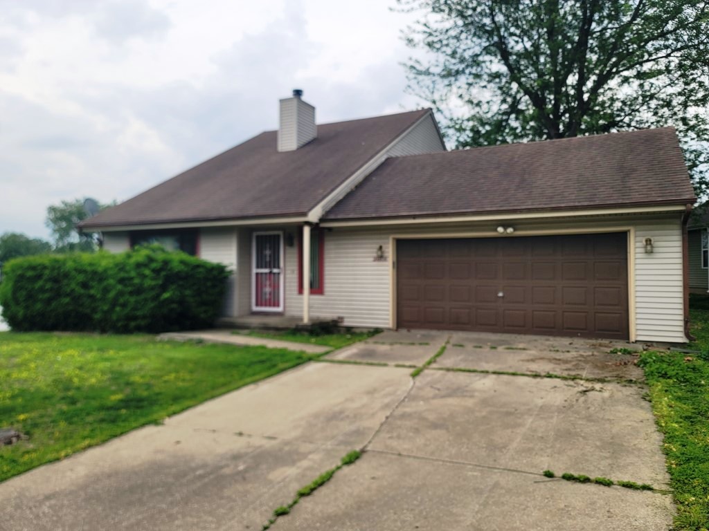 2601 Rachel Road Champaign, IL 61822 - Photo 3 of 22 a front view of a house with a yard and garage