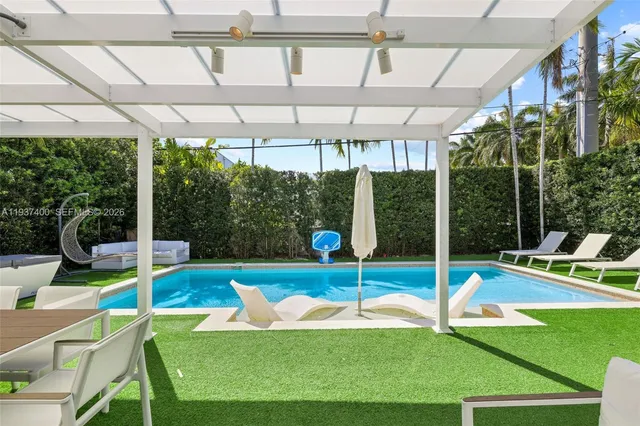 a view of a swimming pool with a patio