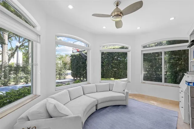 a living room with furniture and windows