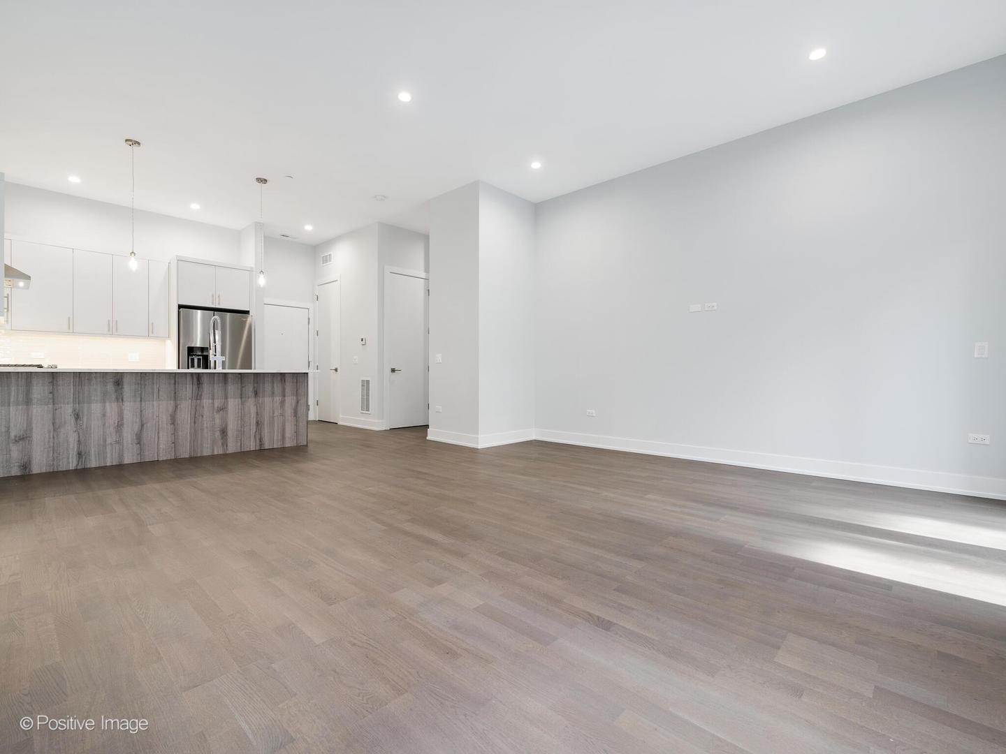 2139 West Madison Street, Unit 201 Chicago, IL 60612 - Photo 7 of 11 a view of kitchen and wooden floor