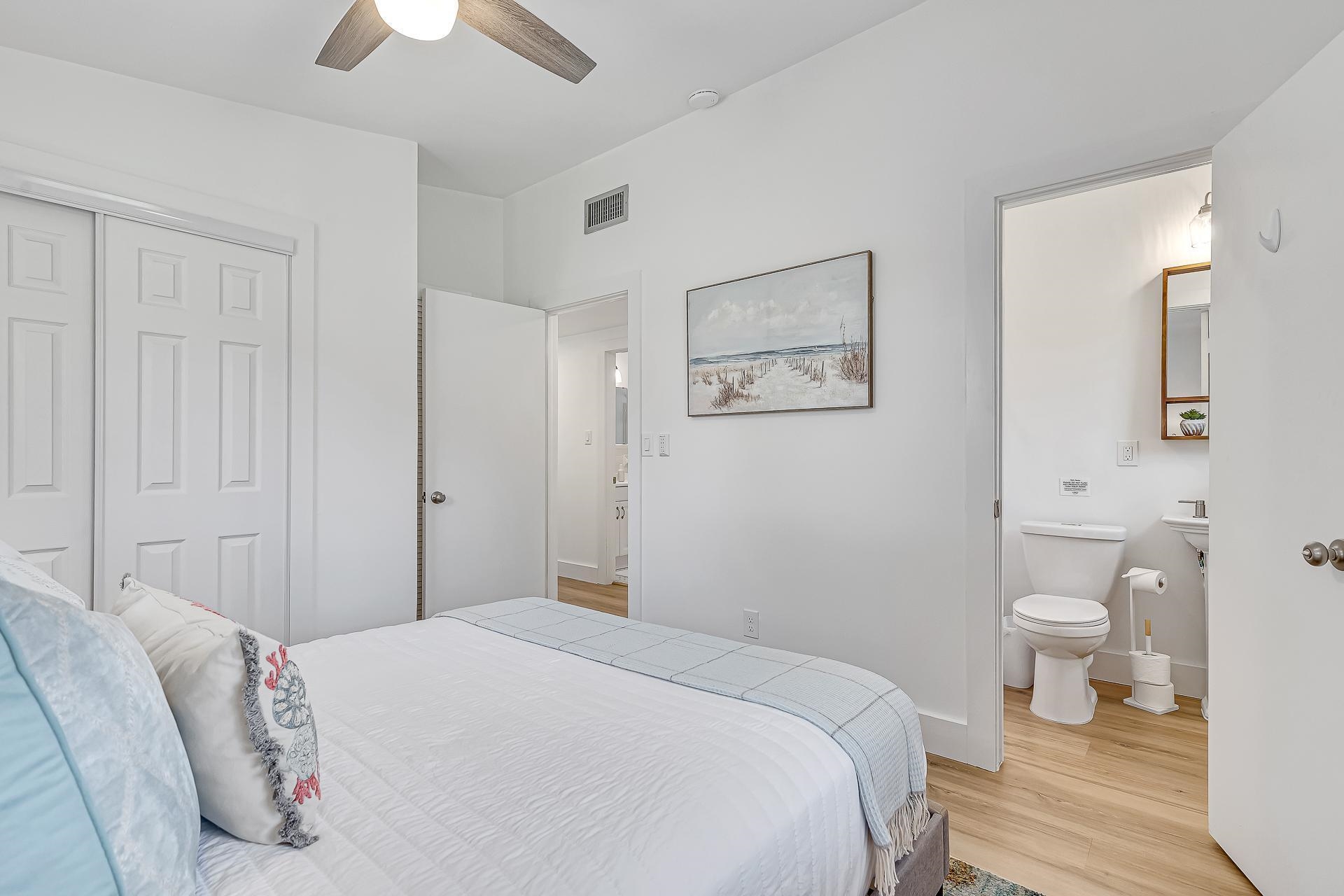 110 Terrapin Road St. Augustine, FL 32086 - Photo 15 of 46 a bedroom with a toilet and a painting on the wall