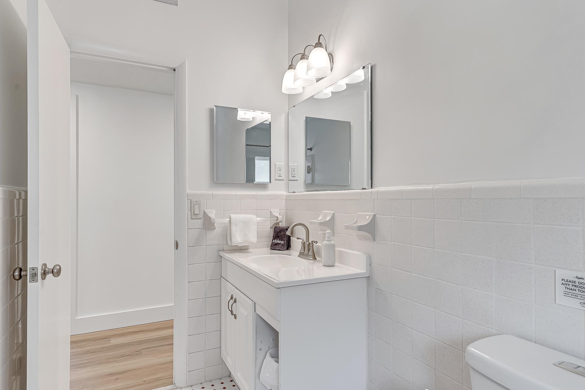 110 Terrapin Road St. Augustine, FL 32086 - Photo 23 of 46 a bathroom with a sink vanity and toilet