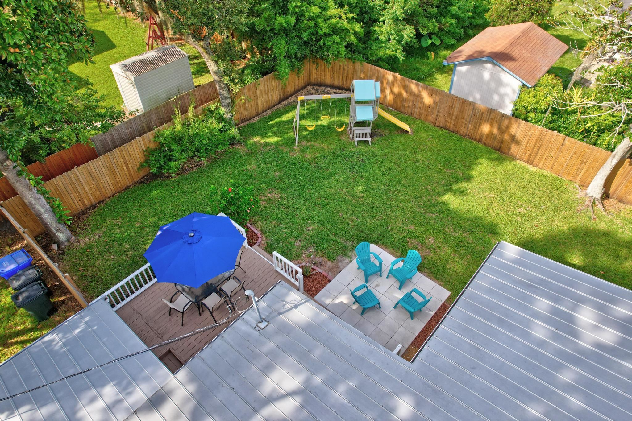 110 Terrapin Road St. Augustine, FL 32086 - Photo 37 of 46 a view of a chairs and table in backyard