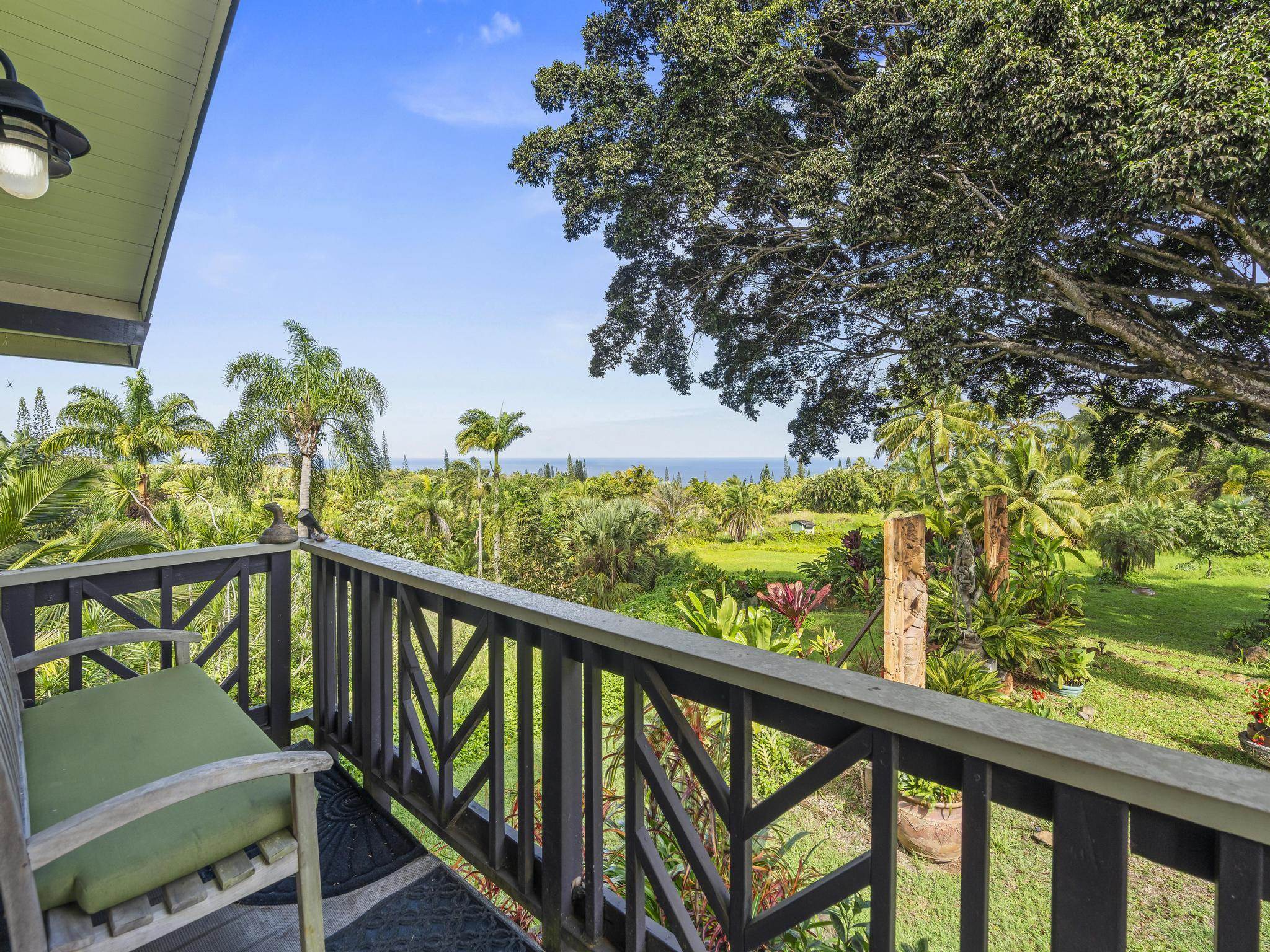 245 North Honokala Road, Unit A Haiku, HI 96708 - Photo 17 of 36 a view of a balcony with flower plants