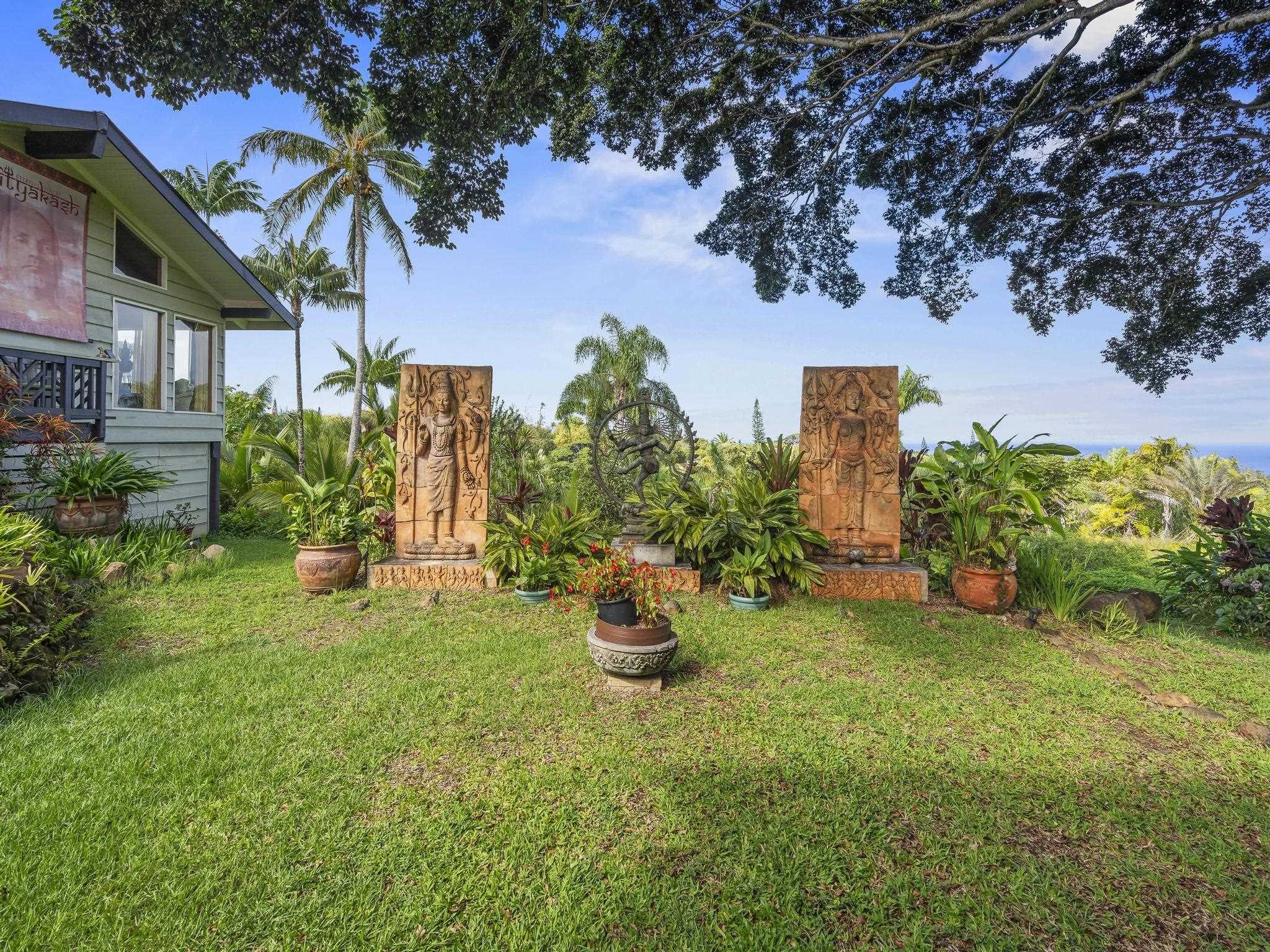 245 North Honokala Road, Unit A Haiku, HI 96708 - Photo 19 of 36 a backyard of a house with seating space