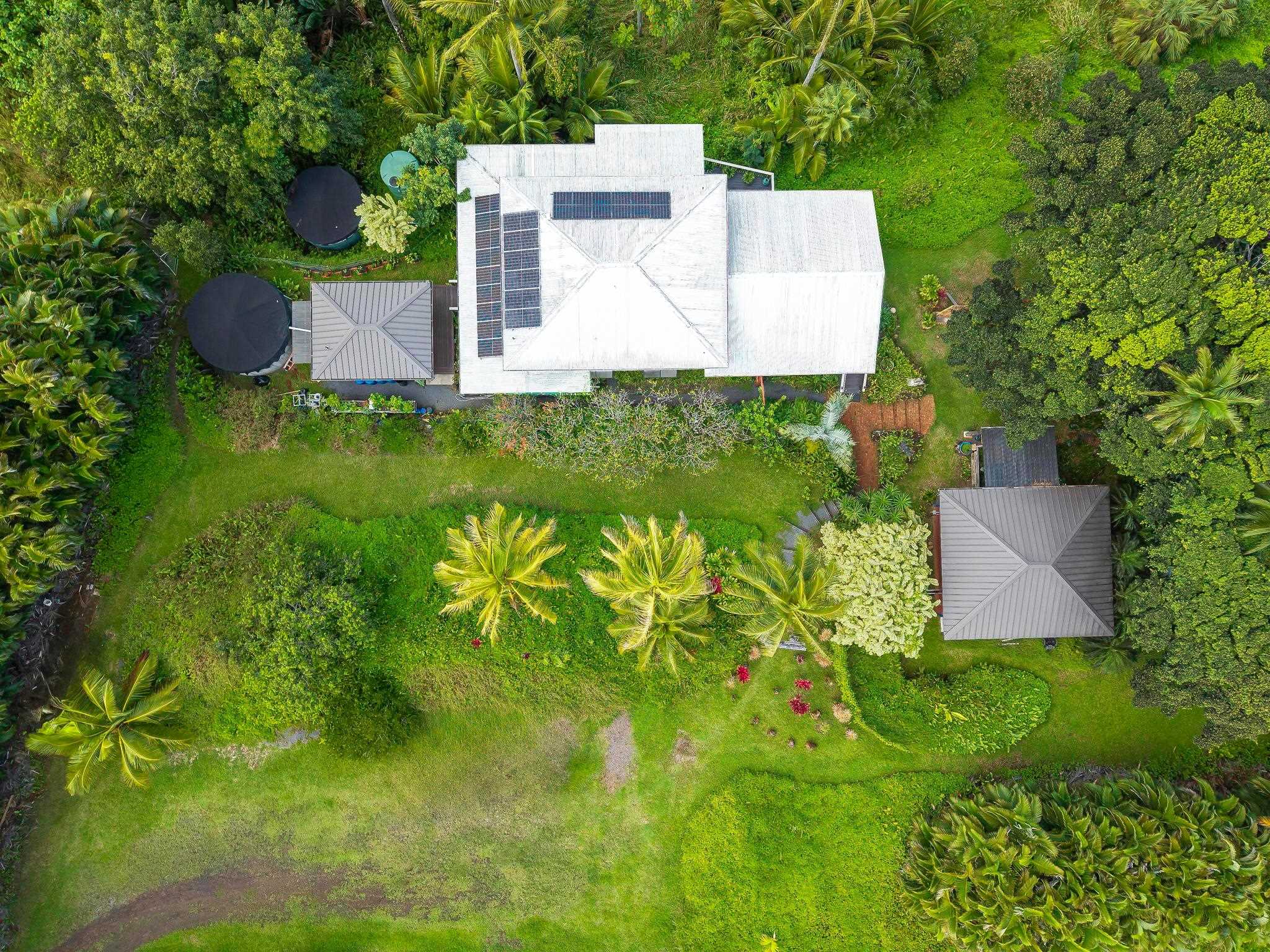 245 North Honokala Road, Unit A Haiku, HI 96708 - Photo 2 of 36 an aerial view of a house with pool yard and outdoor seating