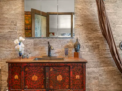 a bathroom with a sink a vanity and a mirror