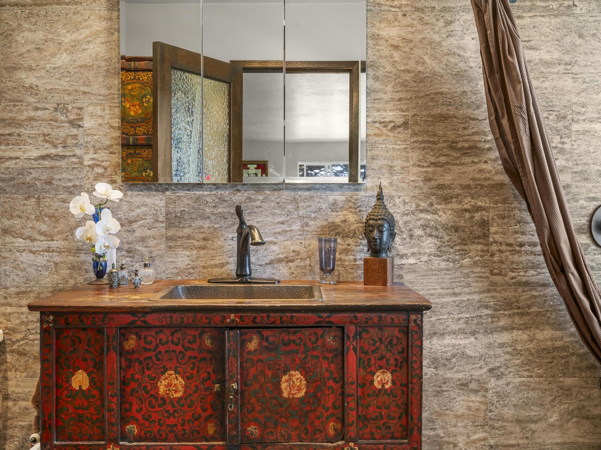 245 North Honokala Road, Unit A Haiku, HI 96708 - Photo 8 of 36 a bathroom with a sink a vanity and a mirror