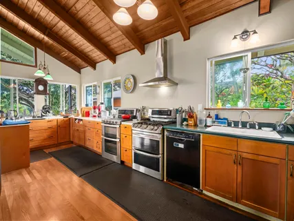 a kitchen that has a lot of cabinets in it