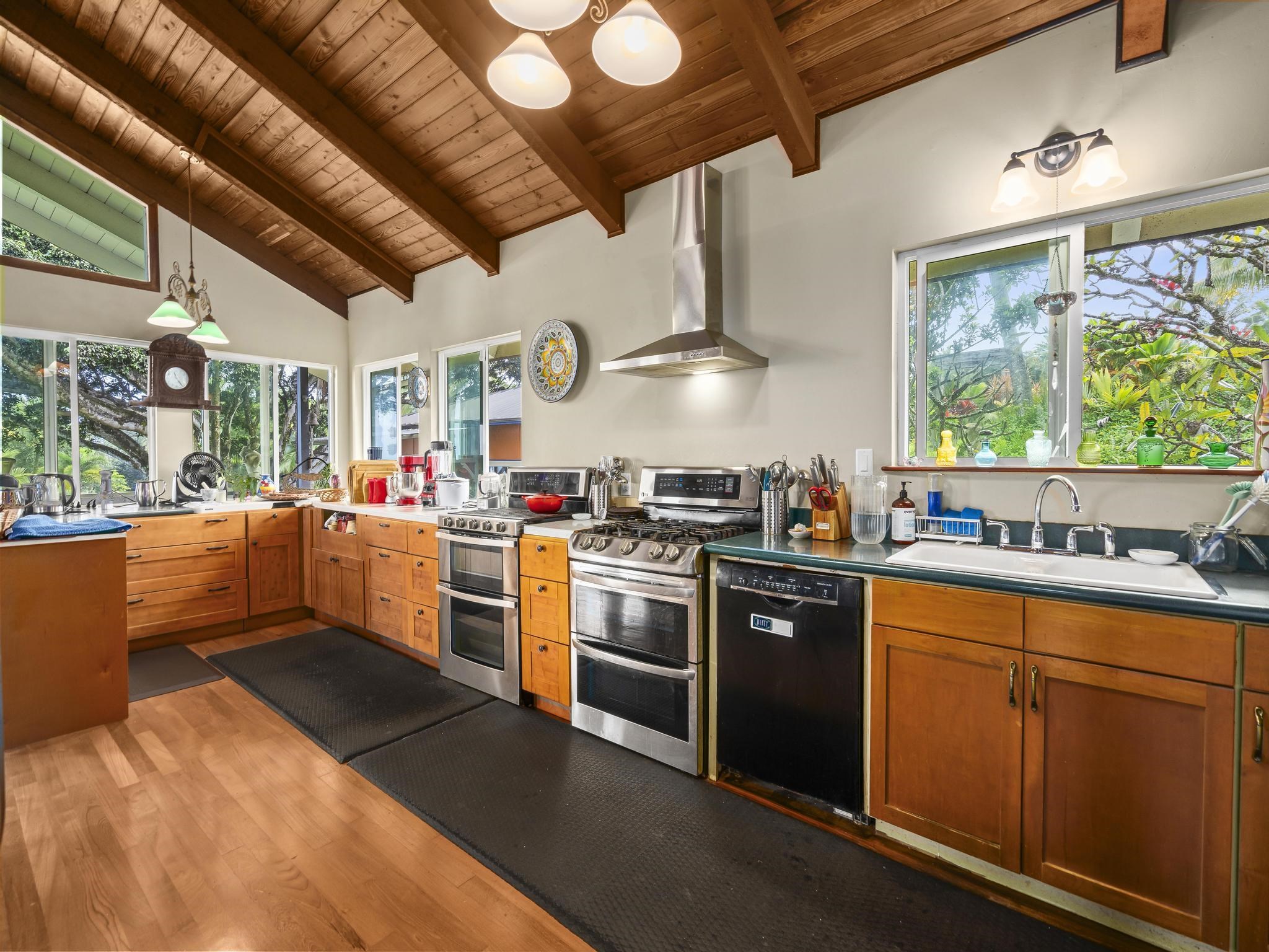 245 North Honokala Road, Unit A Haiku, HI 96708 - Photo 9 of 36 a kitchen that has a lot of cabinets in it