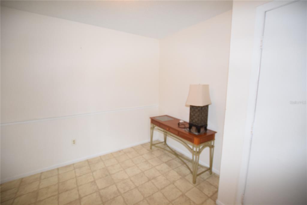 4659 Cason Cove Drive, Unit 3022 Orlando, FL 32811 - Photo 11 of 29 a picture of a bench in a room
