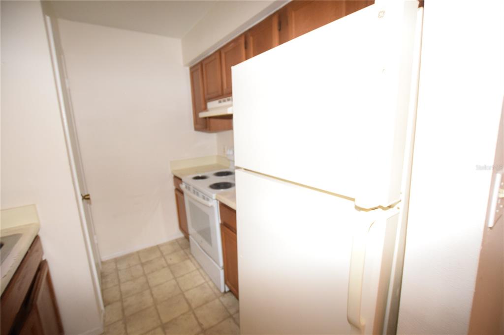 4659 Cason Cove Drive, Unit 3022 Orlando, FL 32811 - Photo 17 of 29 a utility room with dryer and washer