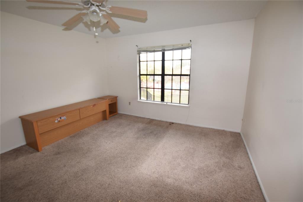 4659 Cason Cove Drive, Unit 3022 Orlando, FL 32811 - Photo 20 of 29 an empty room with windows