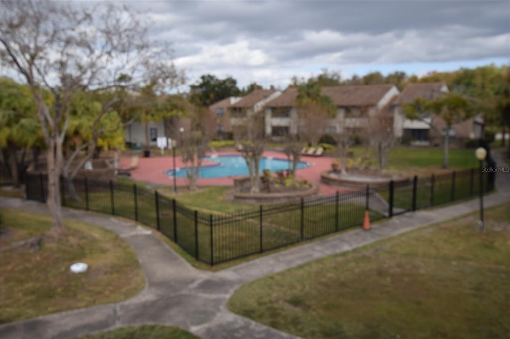 4659 Cason Cove Drive, Unit 3022 Orlando, FL 32811 - Photo 28 of 29 a view of a backyard